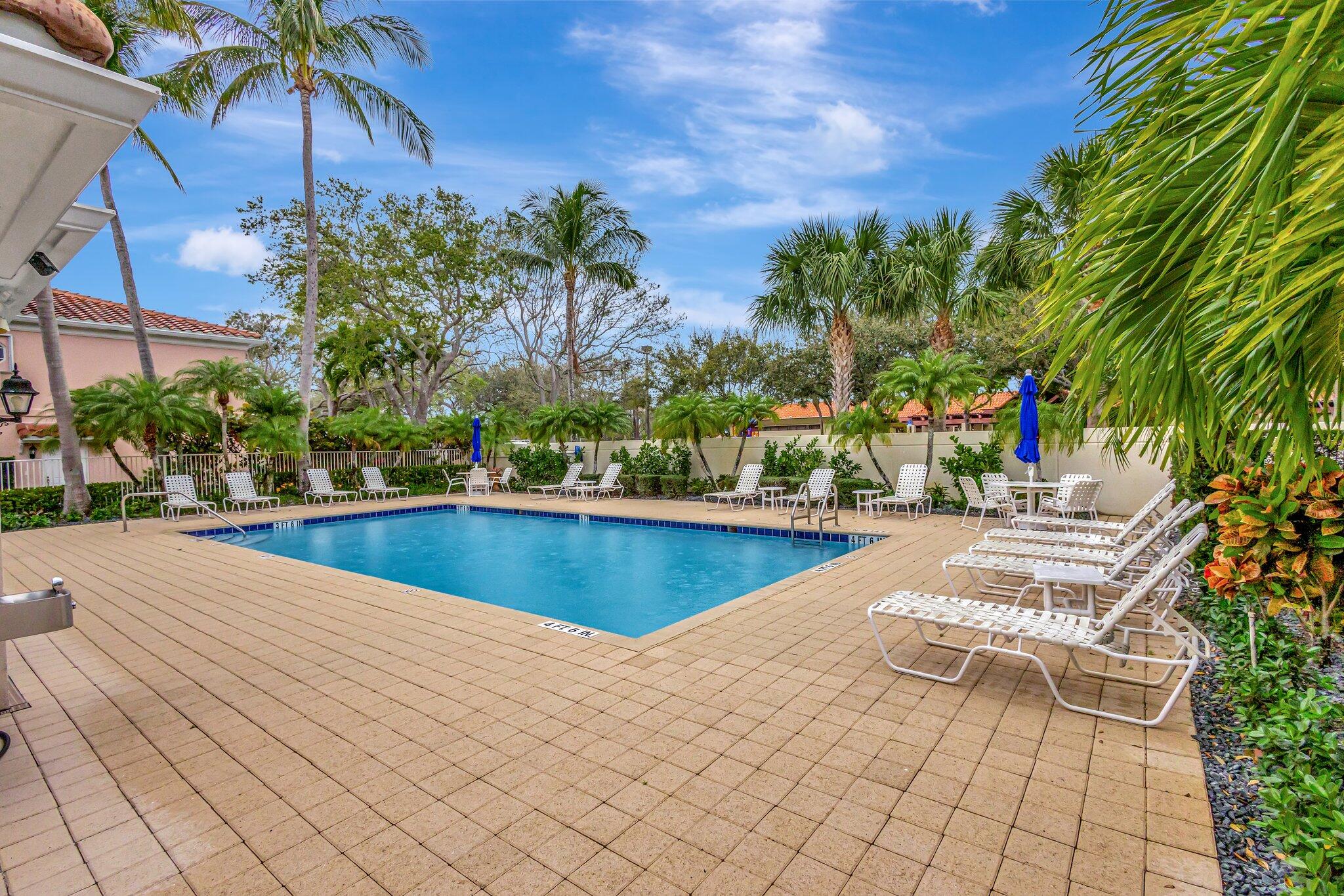 39 Laurel Oaks Circle Tequesta, FL 33469 - Photo 40 of 47 a view of swimming pool with chairs