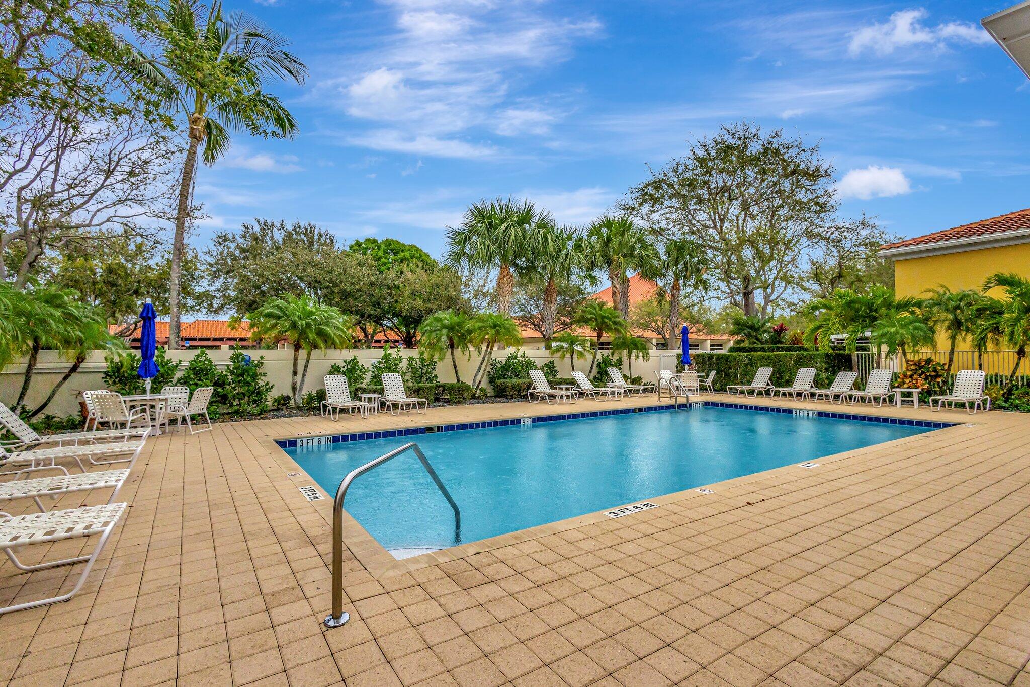 39 Laurel Oaks Circle Tequesta, FL 33469 - Photo 41 of 47 a view of swimming pool with outdoor seating and plants