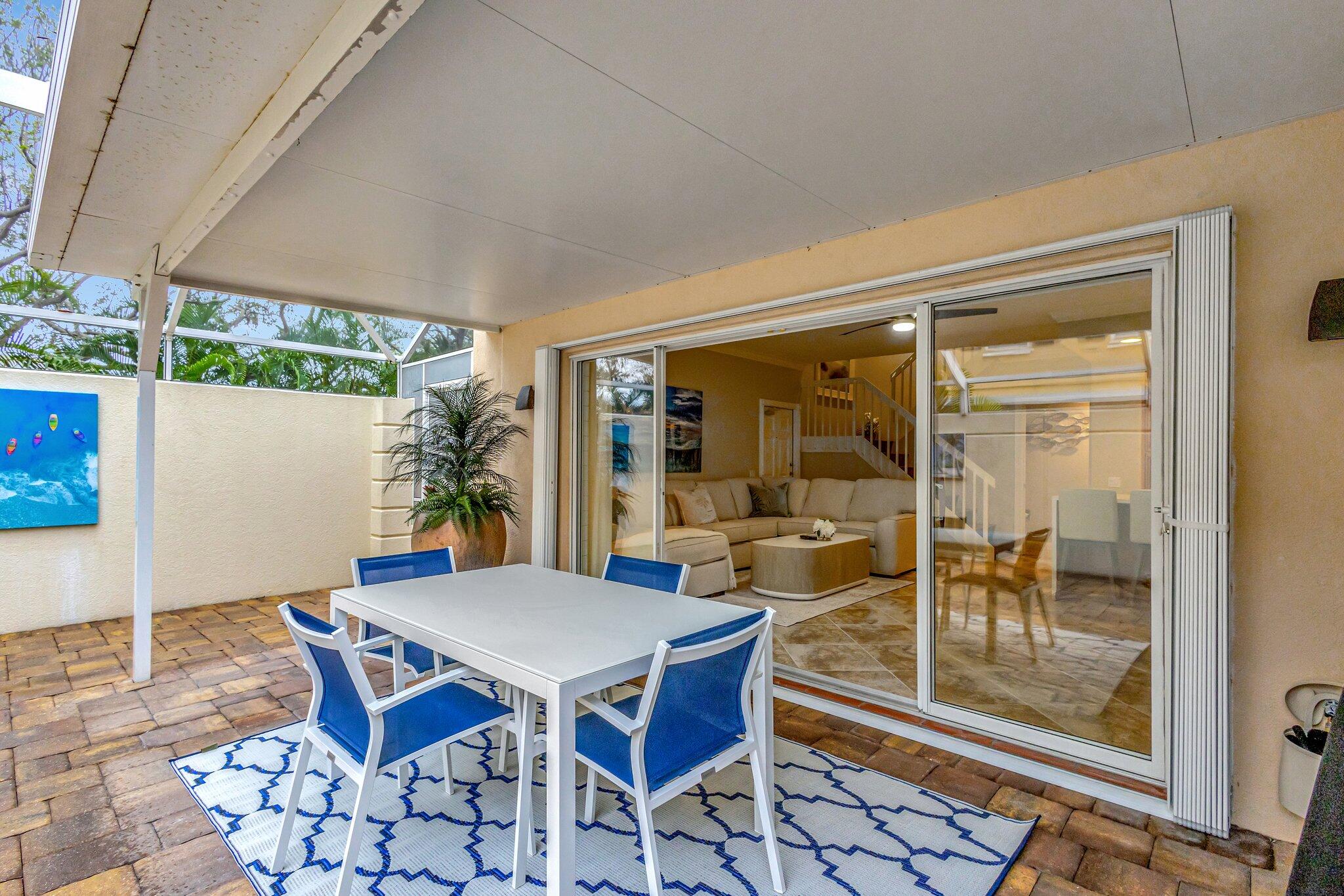39 Laurel Oaks Circle Tequesta, FL 33469 - Photo 43 of 47 a view of a dining room with furniture wooden floor and glass door