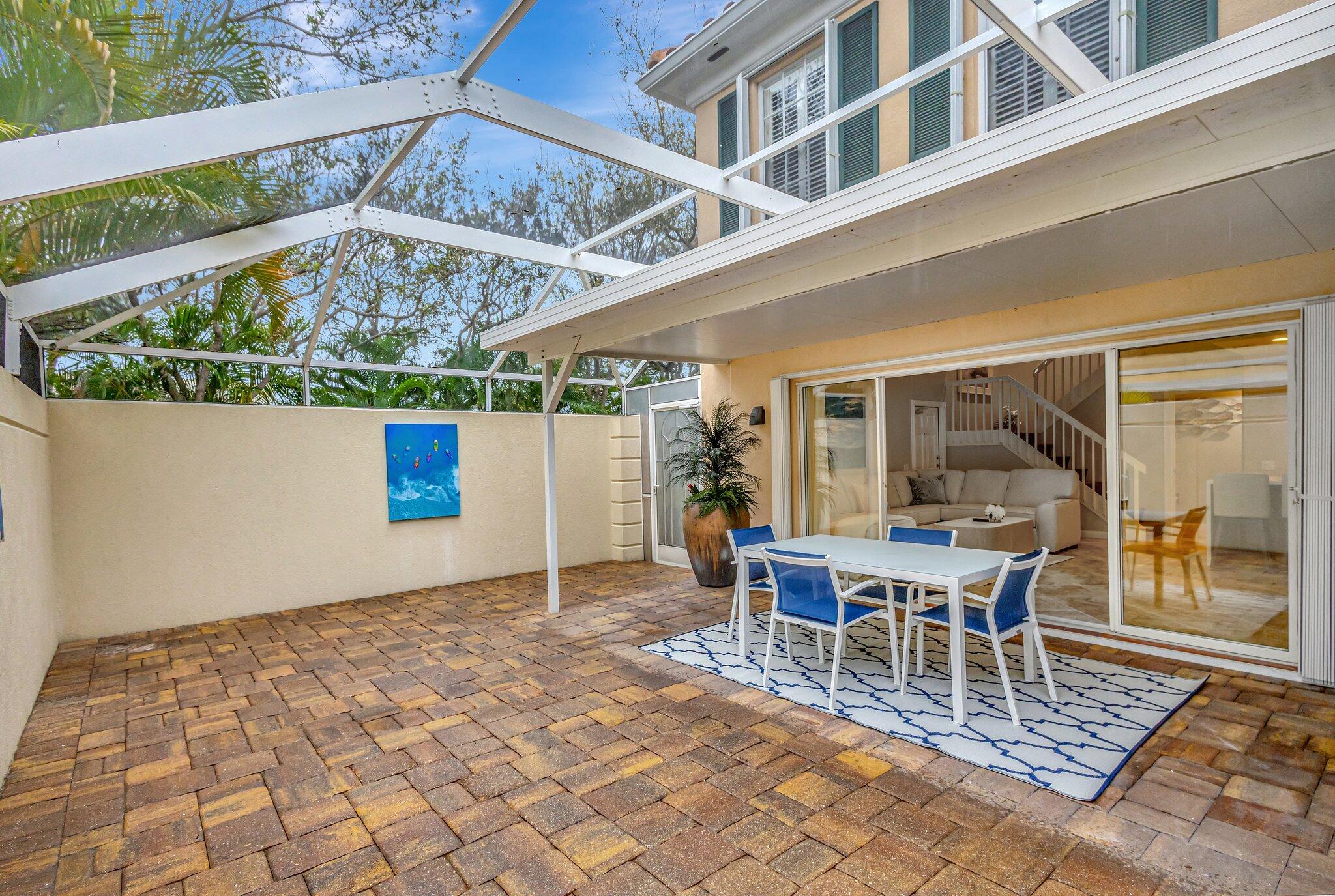 39 Laurel Oaks Circle Tequesta, FL 33469 - Photo 47 of 47 a outdoor space with lots of tables a garden and view of a chair