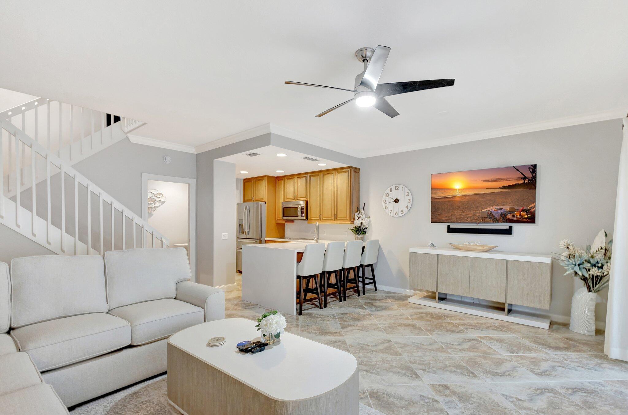 39 Laurel Oaks Circle Tequesta, FL 33469 - Photo 5 of 47 a living room with furniture and a flat screen tv