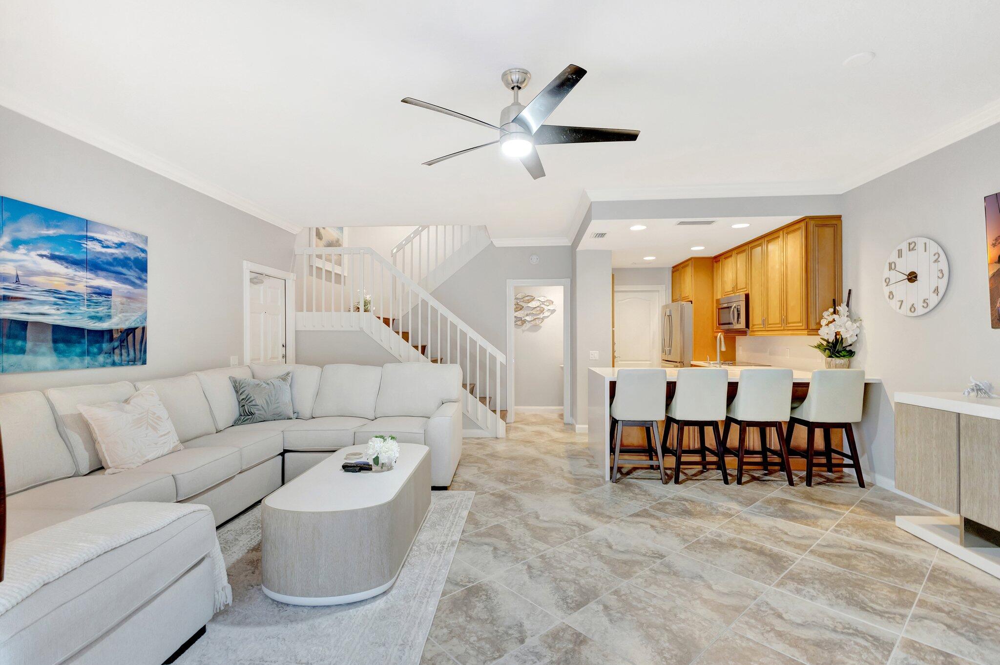 39 Laurel Oaks Circle Tequesta, FL 33469 - Photo 6 of 47 a living room with furniture and kitchen view