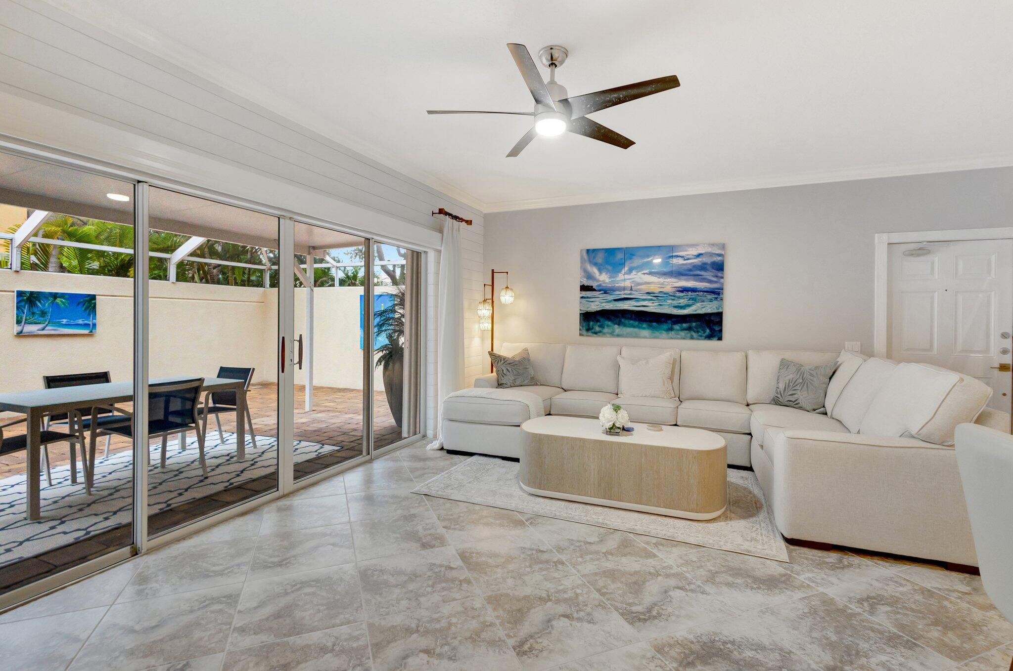 39 Laurel Oaks Circle Tequesta, FL 33469 - Photo 8 of 47 a living room with furniture and a large window