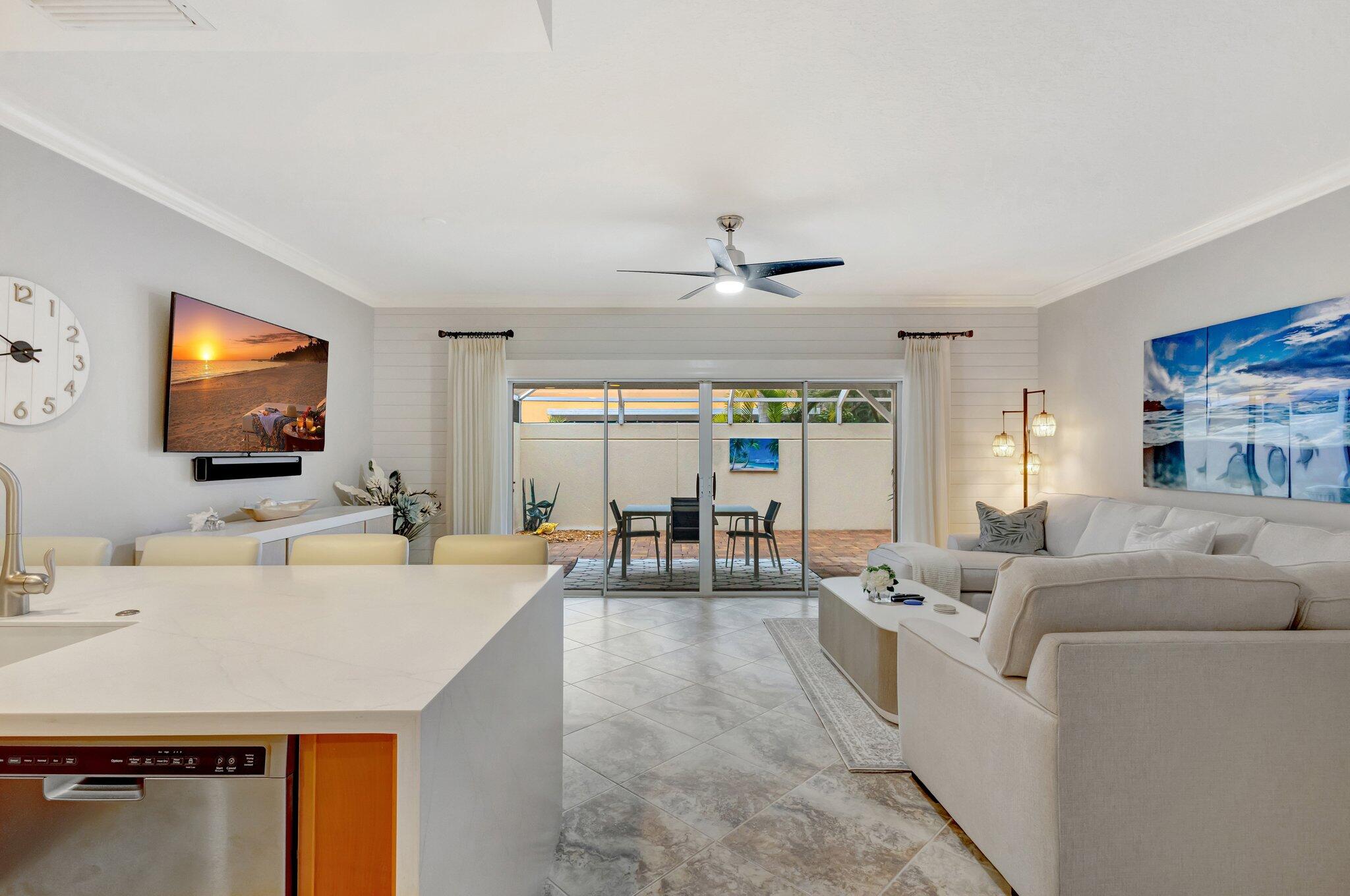 39 Laurel Oaks Circle Tequesta, FL 33469 - Photo 9 of 47 a living room with furniture and a flat screen tv