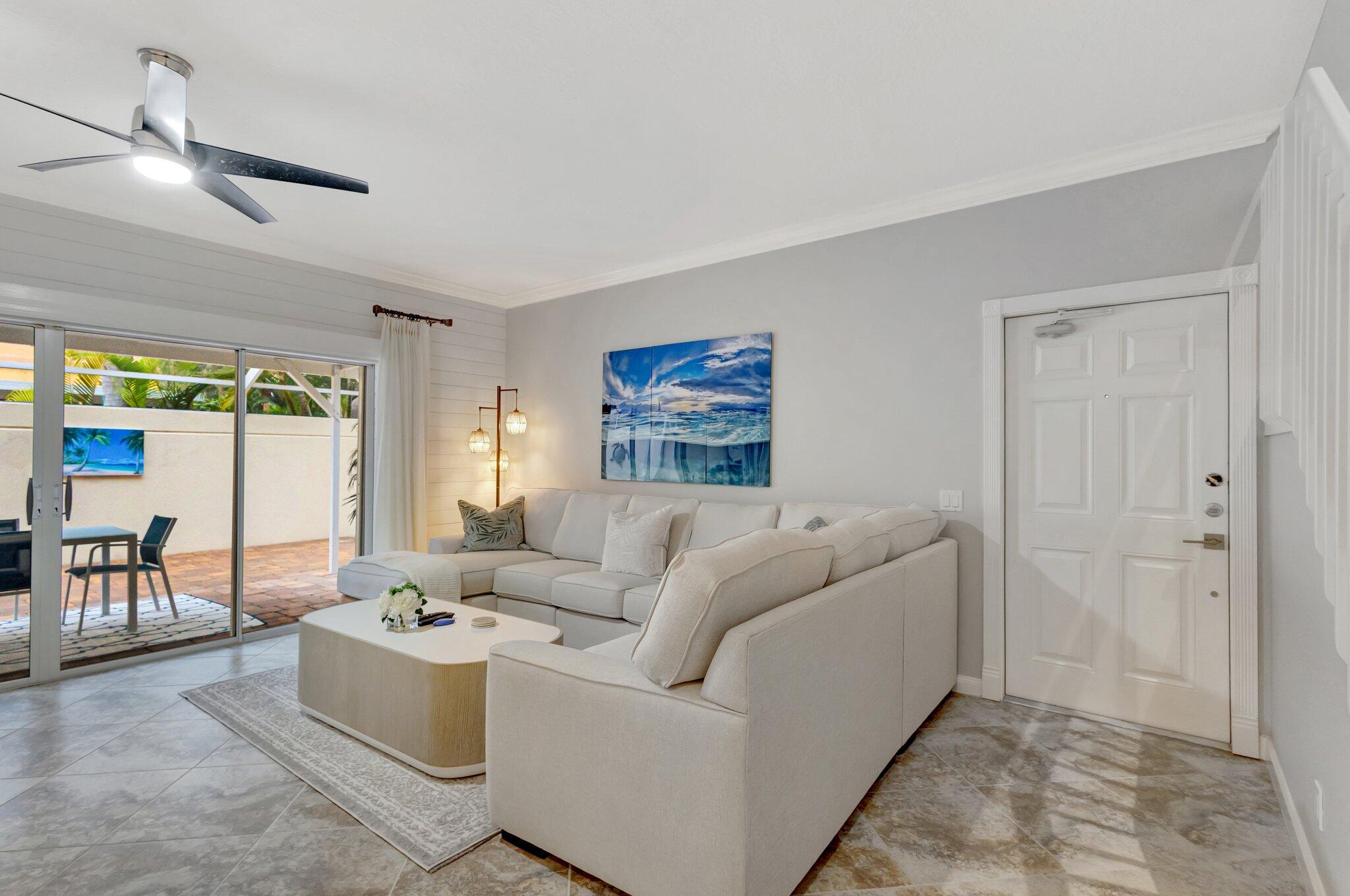 39 Laurel Oaks Circle Tequesta, FL 33469 - Photo 10 of 47 a living room with furniture and a large window