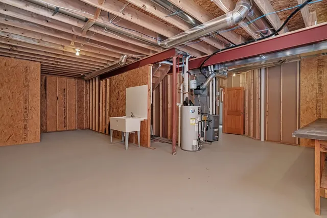 a view of a room with air conditioner duct and materials on floor