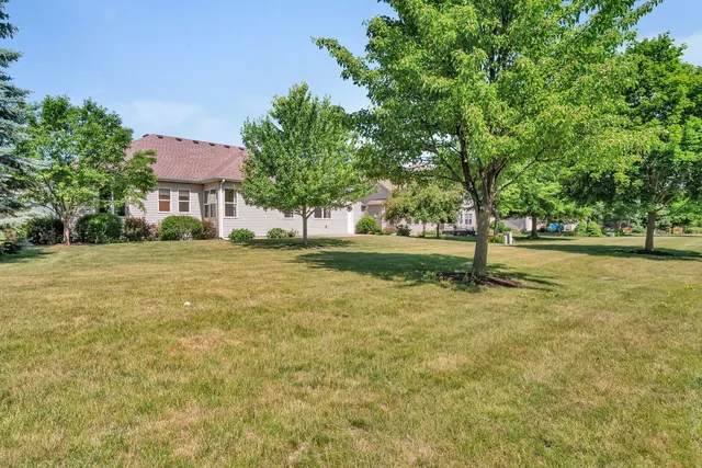 a backyard of a house with lots of green space