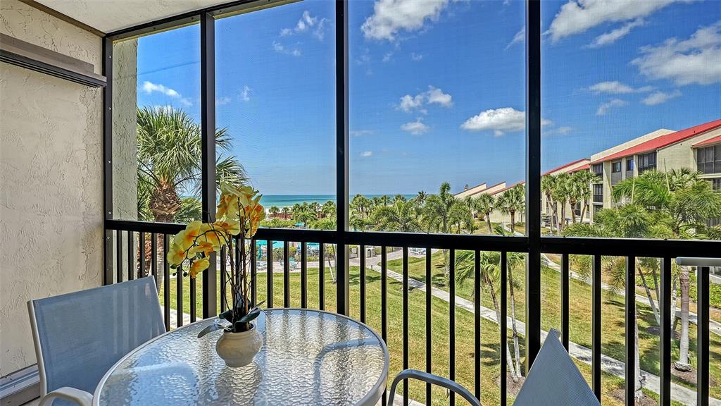 6234 Midnight Pass Road, Unit 307 Sarasota, FL 34242 - Photo 16 of 61 a balcony view with a garden space