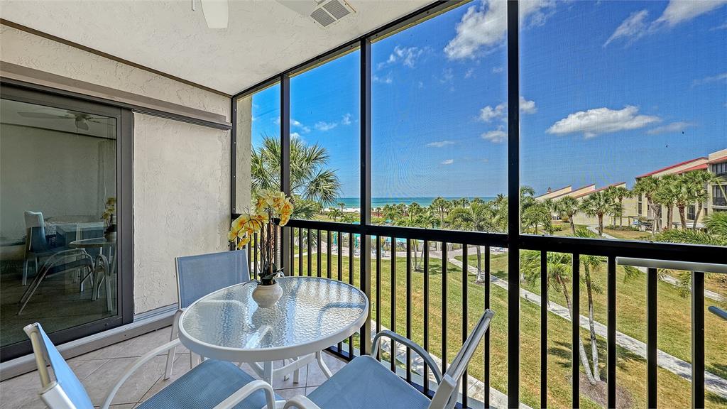 6234 Midnight Pass Road, Unit 307 Sarasota, FL 34242 - Photo 17 of 61 a view of a balcony furniture and a potted plant