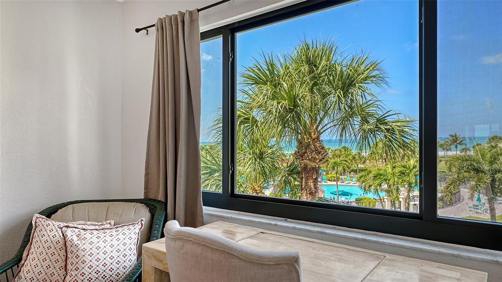 6234 Midnight Pass Road, Unit 307 Sarasota, FL 34242 - Photo 24 of 61 a room with a bed and a window