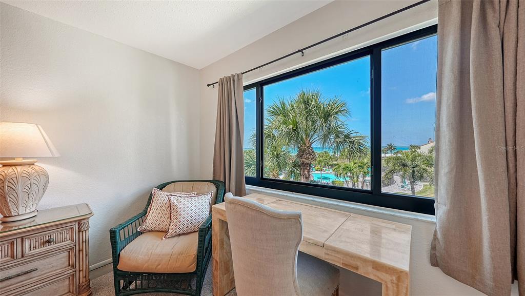 6234 Midnight Pass Road, Unit 307 Sarasota, FL 34242 - Photo 25 of 61 a living room with furniture and a window