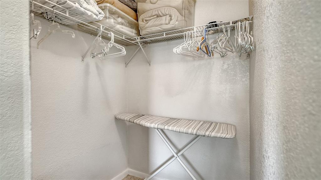 6234 Midnight Pass Road, Unit 307 Sarasota, FL 34242 - Photo 35 of 61 a view of a room with racks on the wall