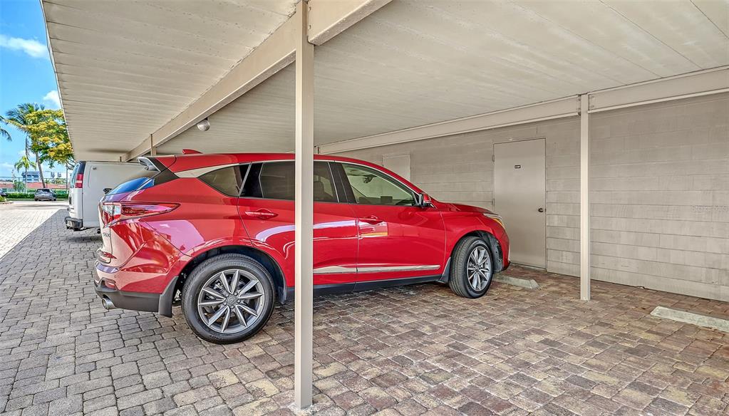 6234 Midnight Pass Road, Unit 307 Sarasota, FL 34242 - Photo 37 of 61 a view of a car in garage