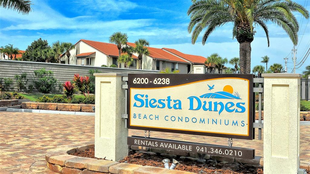 6234 Midnight Pass Road, Unit 307 Sarasota, FL 34242 - Photo 38 of 61 a sign on the side of a building