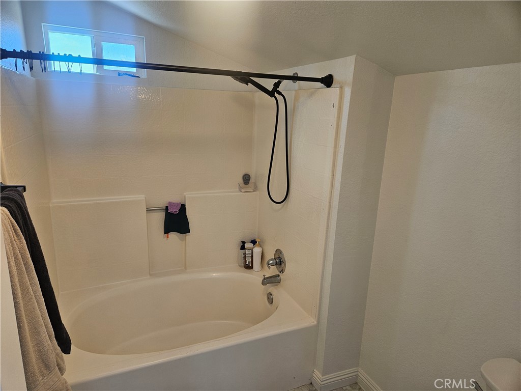 37323 Daybreak Street Palmdale, CA 93550 - Photo 42 of 58 a bathroom with a bath tub and a shower