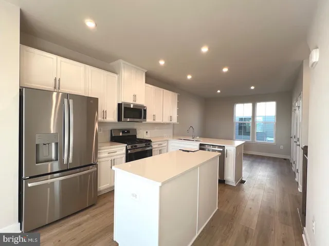 a view of a kitchen with a dishwasher and cabinets