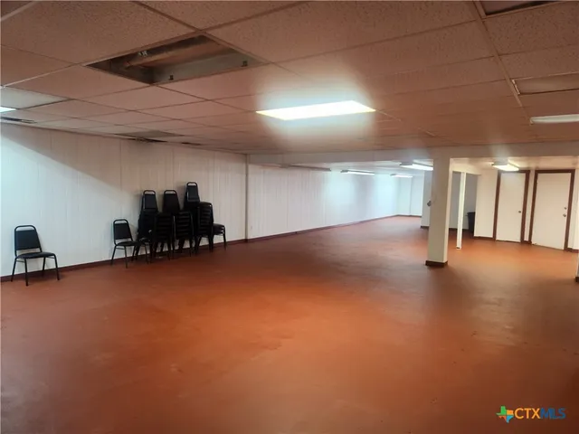 a view of empty room with staircase