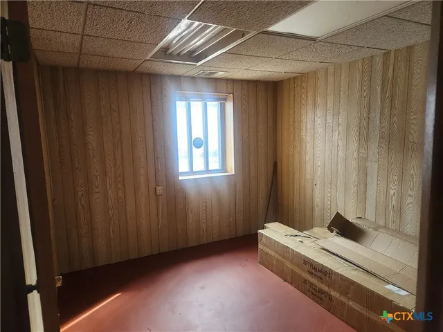 a room with a bed and a window