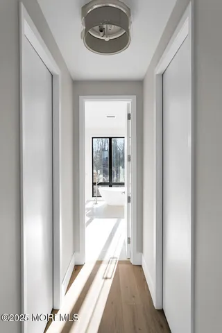 a view of a hallway with a outdoor space