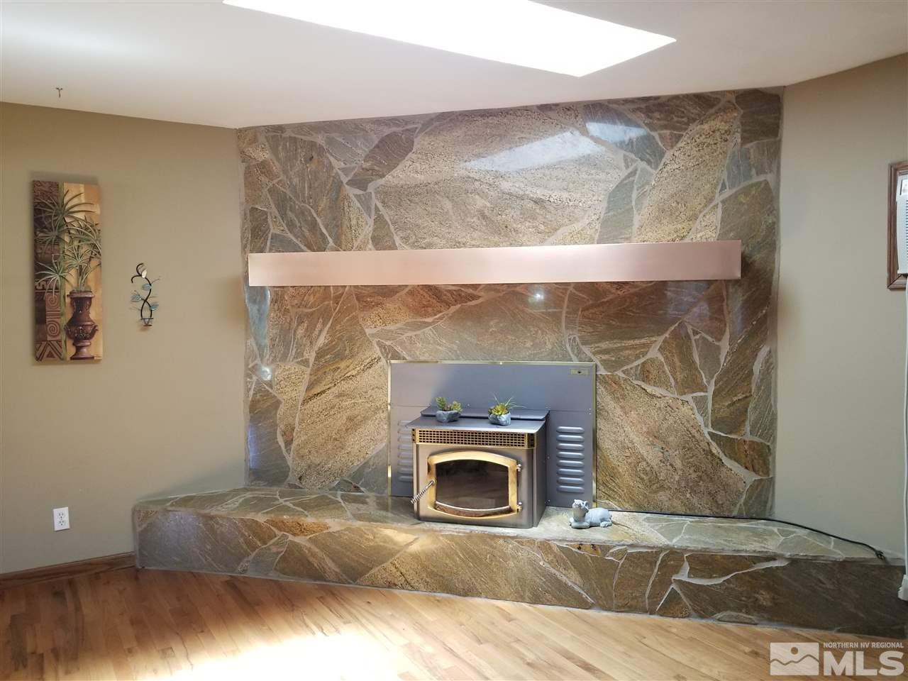 2130 Yuma Lane Reno, NV 89509 - Photo 3 of 25 a living room with a fireplace