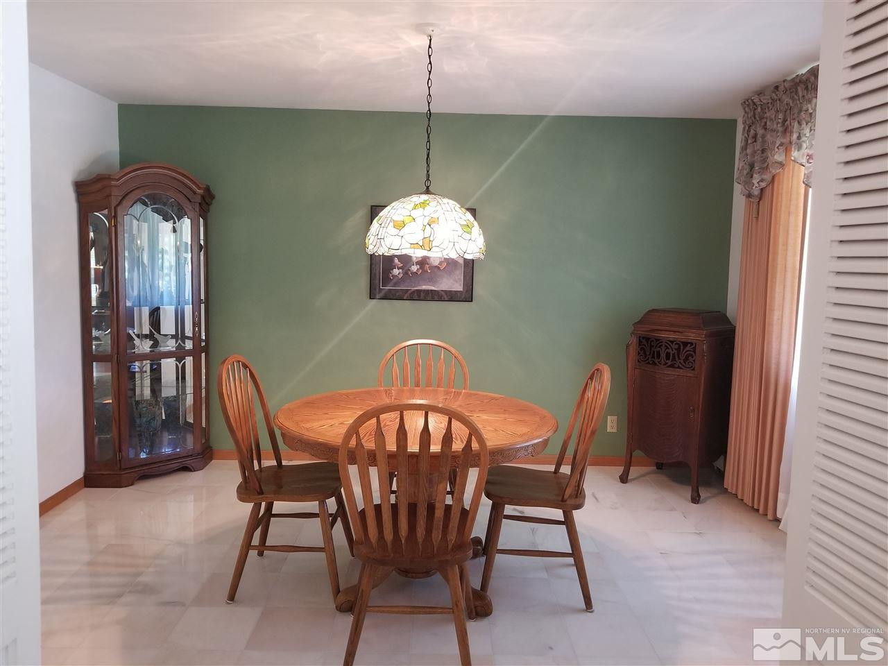 2130 Yuma Lane Reno, NV 89509 - Photo 9 of 25 a view of a dining room with furniture and wooden floor
