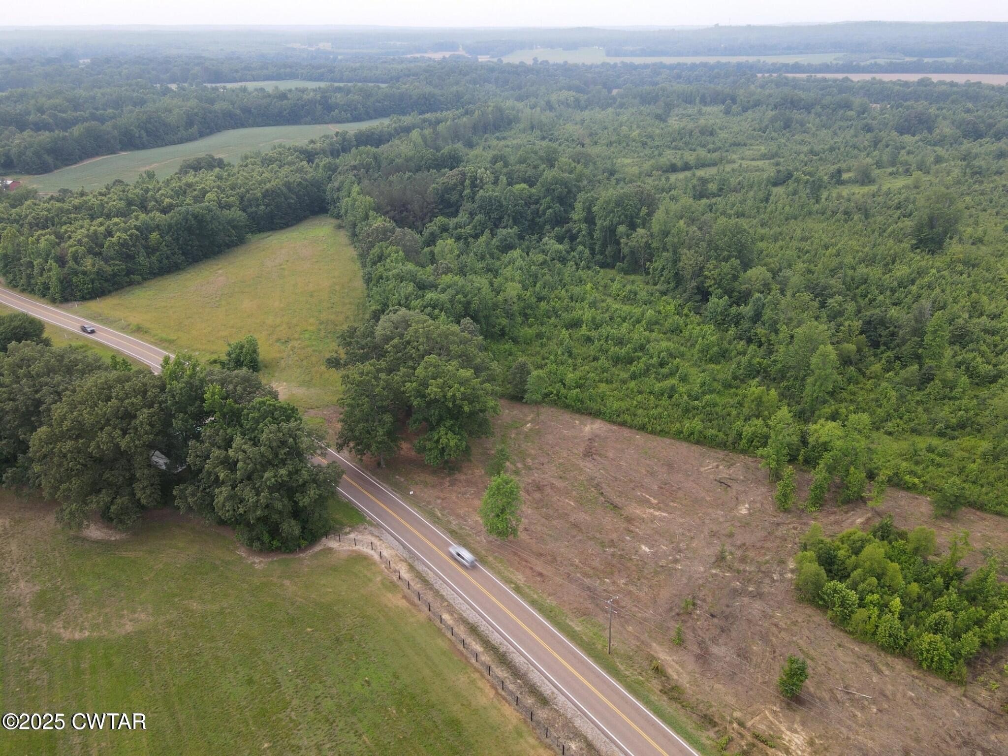 0 State Route South Enville, TN 38332 - Photo 1 of 12 a view of a lake with a mountain in the back