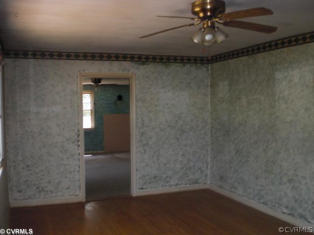 16018 Glebe Road Dewitt, VA 23840 - Photo 3 of 6 a view of a room with wooden floor and chandelier