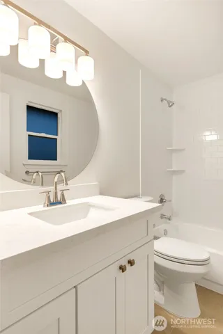 a living room with furniture a flat screen tv and a large window