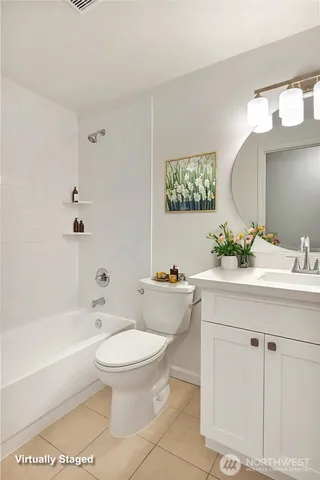 a bathroom with a sink a toilet and bathtub