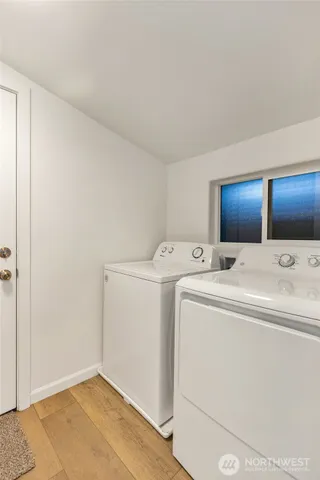 a bathroom with a sink a toilet and a shower