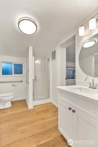 a view of a house with a deck and furniture