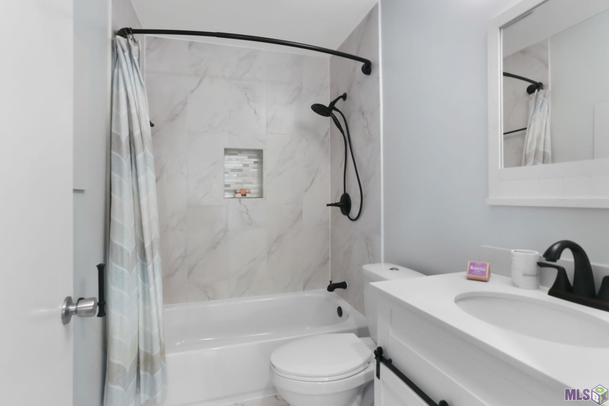 2452 Shadowbrook Drive Baton Rouge, LA 70816 - Photo 17 of 23 Updated hall bathroom