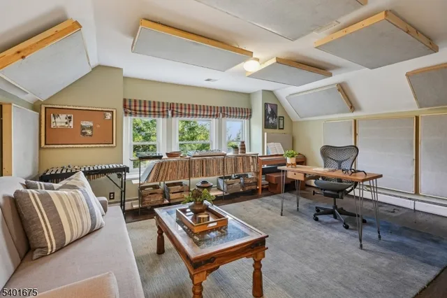 a living room with furniture a rug and a table