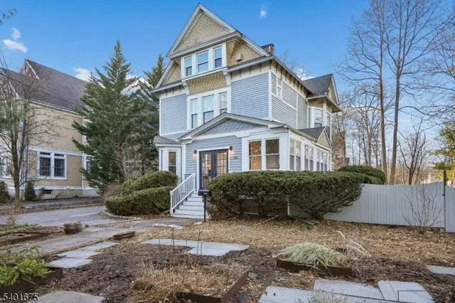 a front view of a house with garden