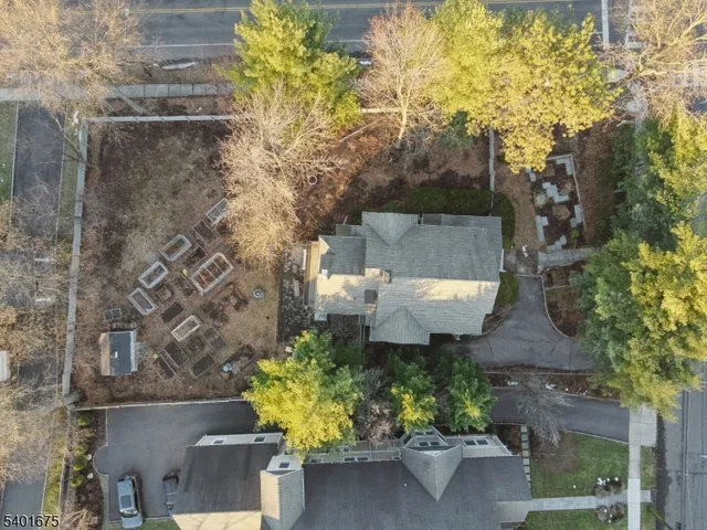 a picture of a bench in front of a white house
