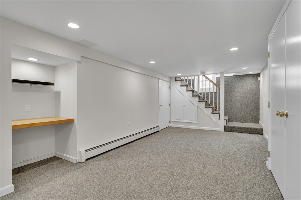 10 Dexter Road Lexington, MA 02420 - Photo 32 of 35 an empty room with wooden floor and windows