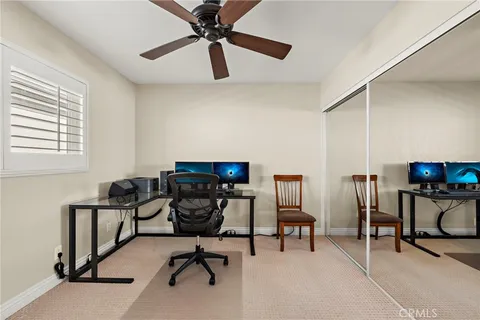 a view of a workspace with furniture