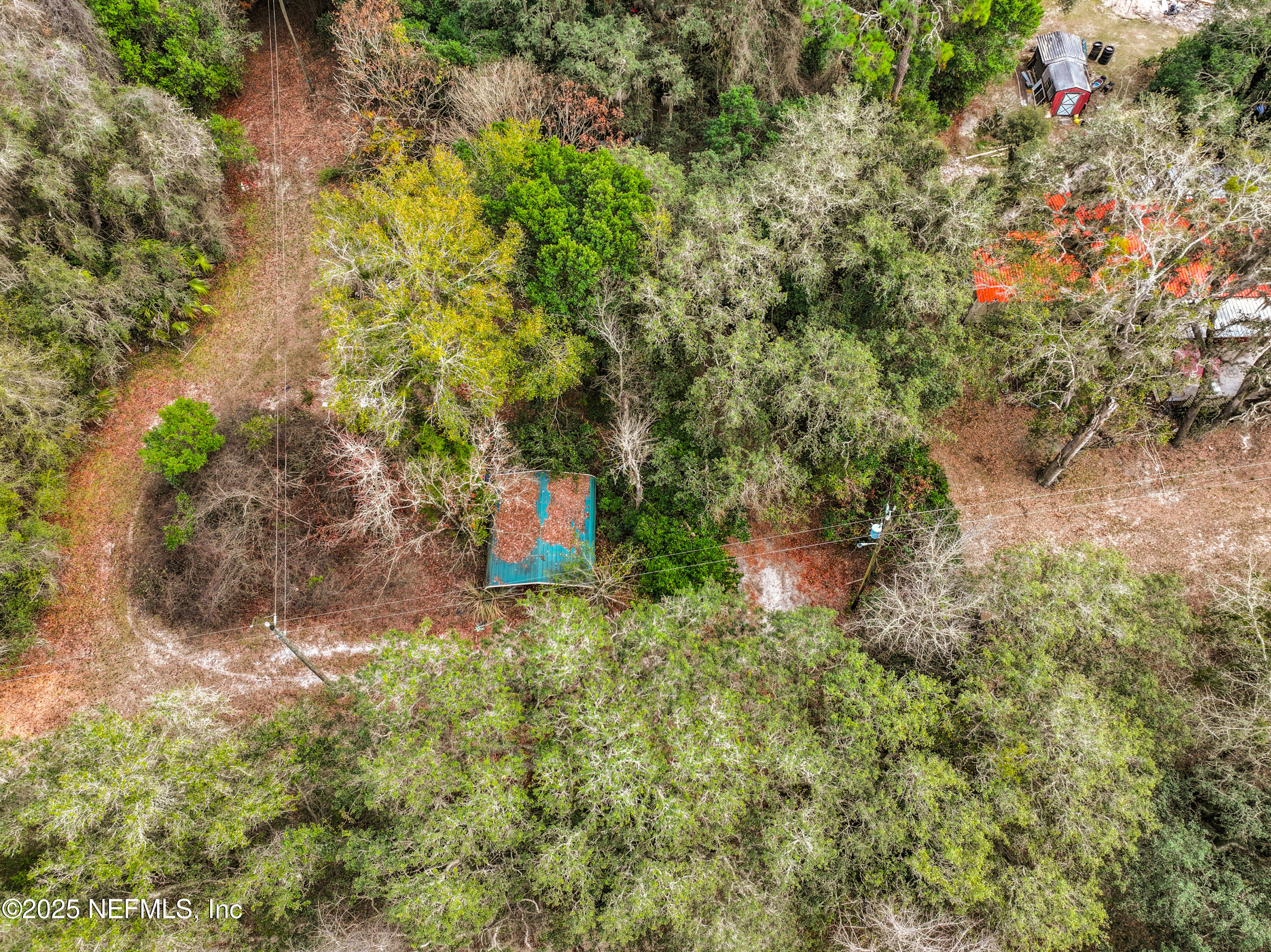 22695 Northeast 130th Court Road Fort McCoy, FL 32134 - Photo 11 of 22 a backyard of a house with a yard and outdoor seating