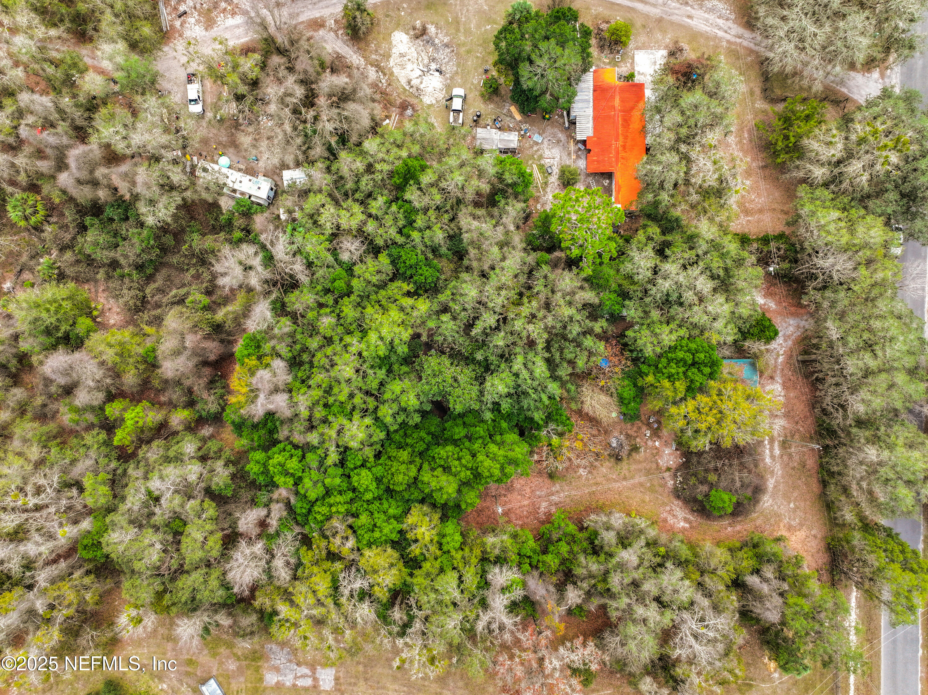 22695 Northeast 130th Court Road Fort McCoy, FL 32134 - Photo 12 of 22 a backyard of a house with a yard and outdoor seating