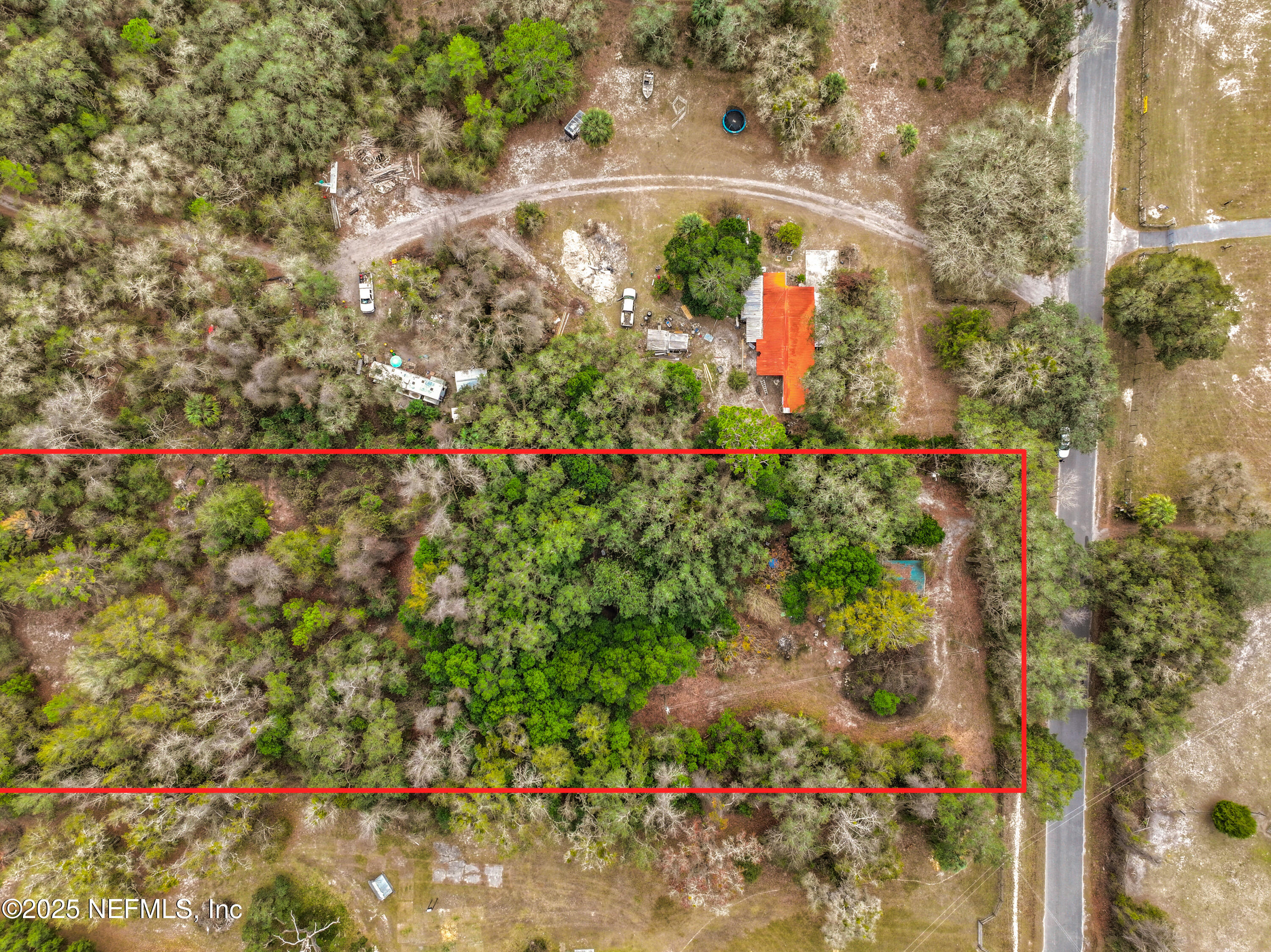 22695 Northeast 130th Court Road Fort McCoy, FL 32134 - Photo 21 of 22 a view of a garden with a fountain