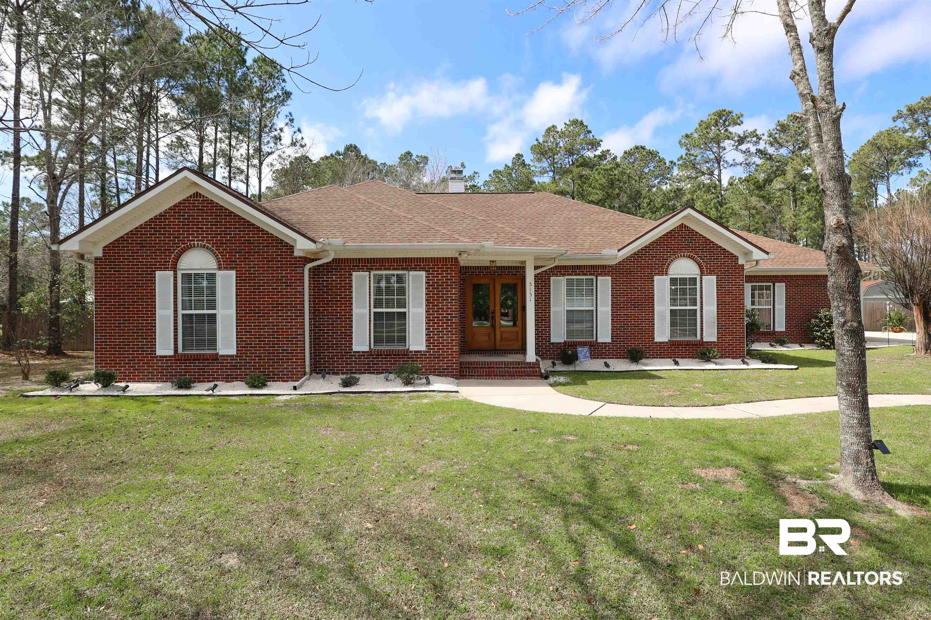5151 Beatrice Road Gulf Shores, AL 36542 - Photo 1 of 50 Ranch-style home with brick siding, a front lawn, roof with shingles, french doors, and a chimney