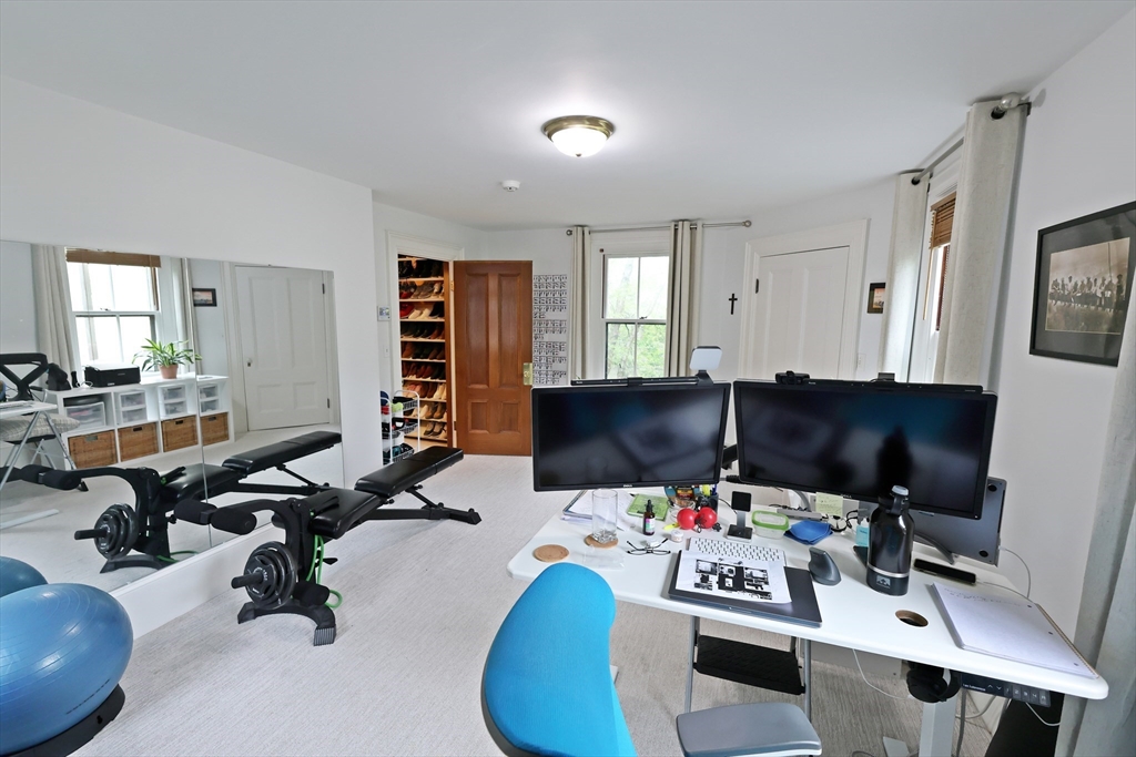 107 Waban Hill Road, Unit R Newton, MA 02467 - Photo 11 of 21 a view of a workspace with a window and couch