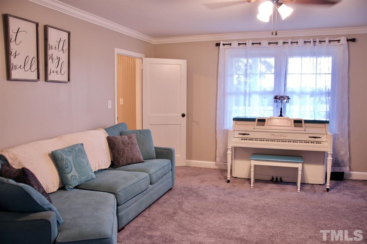 2120 Mary Hobby Road Raleigh, NC 27603 - Photo 12 of 30 a living room with a bed furniture and a window