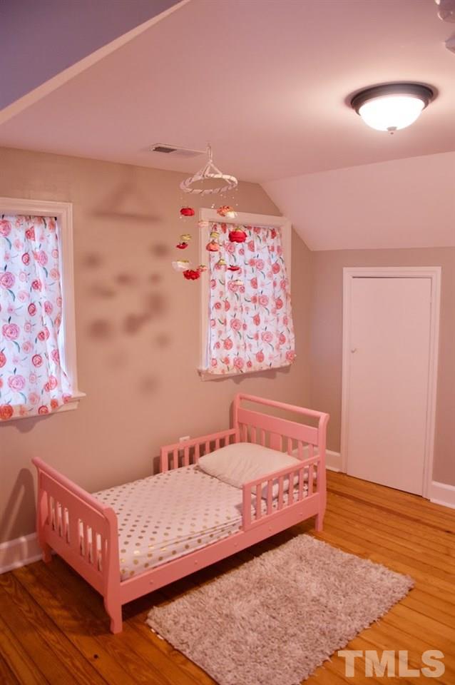2120 Mary Hobby Road Raleigh, NC 27603 - Photo 24 of 30 a bed room with a bed and a couch