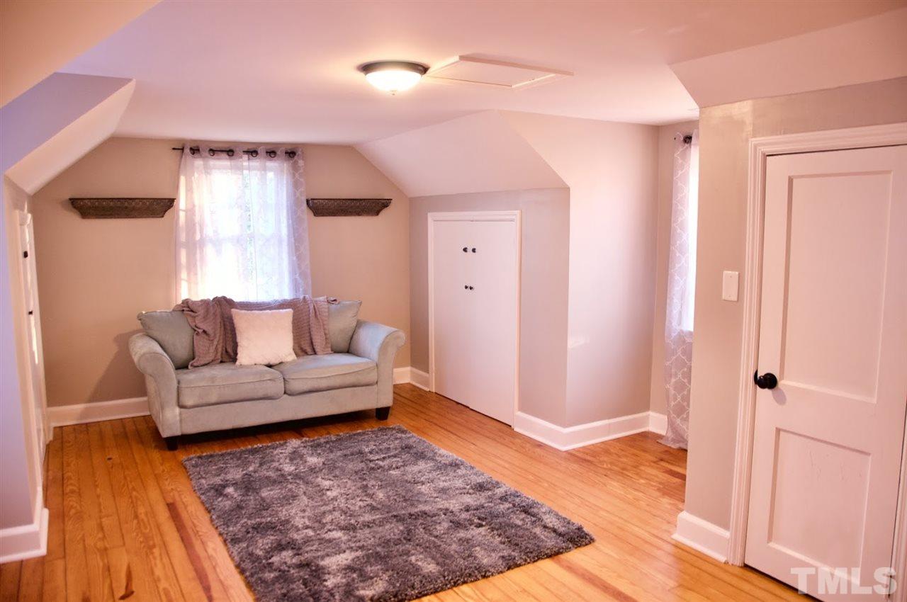 2120 Mary Hobby Road Raleigh, NC 27603 - Photo 26 of 30 a living room with a couch and a rug