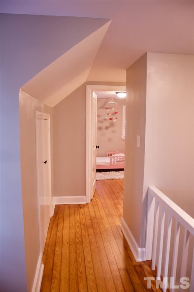 2120 Mary Hobby Road Raleigh, NC 27603 - Photo 27 of 30 a view of a hallway with wooden floor