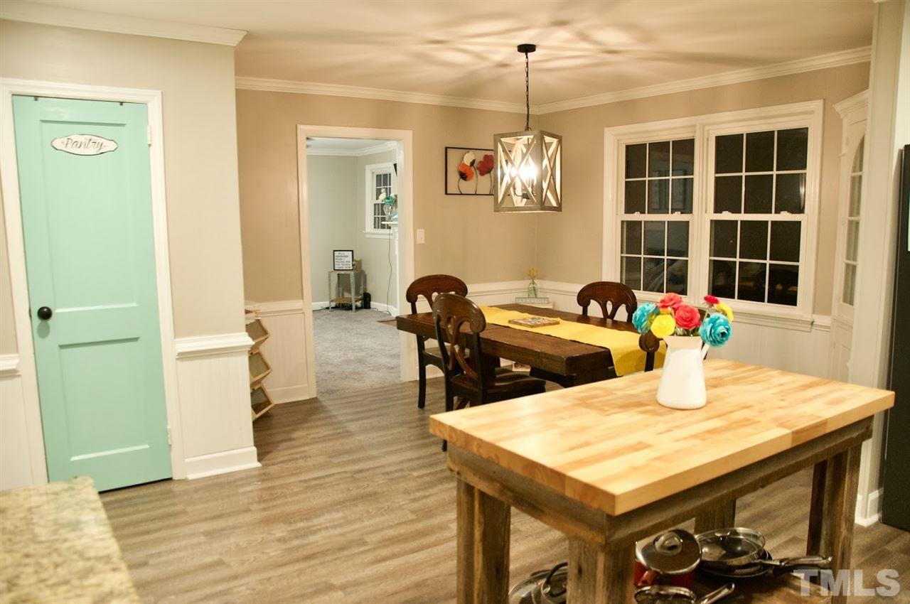 2120 Mary Hobby Road Raleigh, NC 27603 - Photo 5 of 30 a view of a dining room with furniture and chandelier