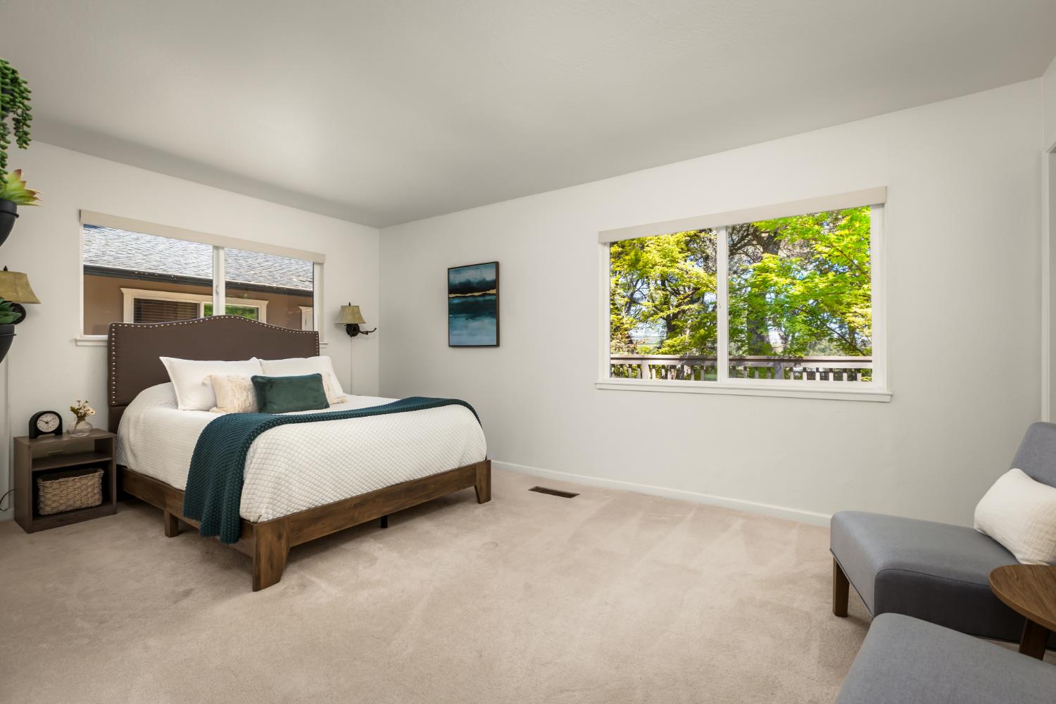 10875 Spenceville Road Penn Valley, CA 95946 - Photo 16 of 49 a spacious bedroom with a bed and a couch