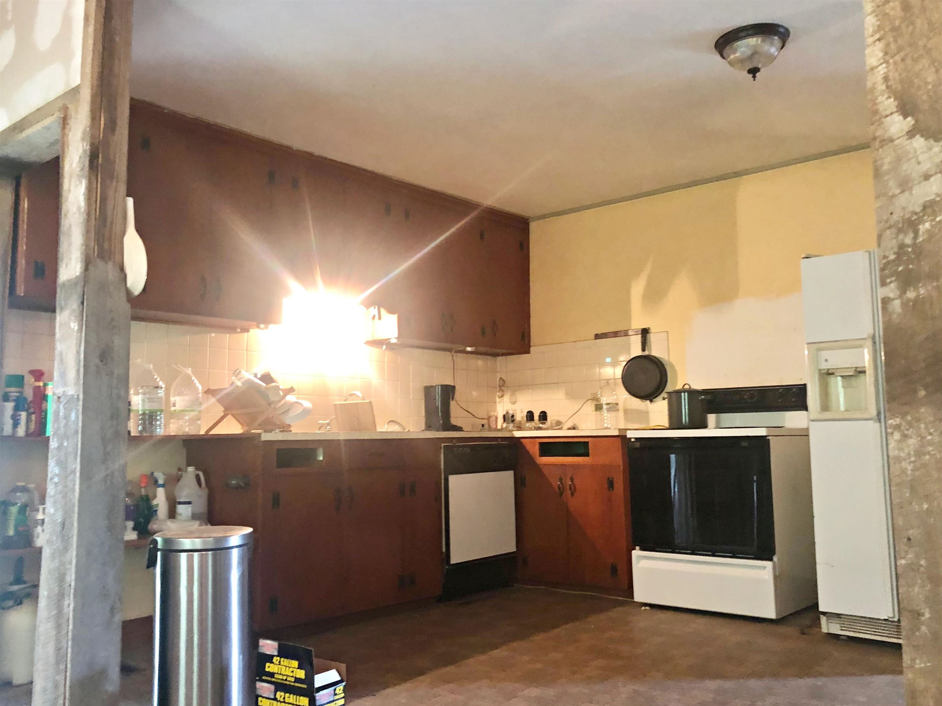 9264 Schuyler Road Schuyler, VA 22969 - Photo 14 of 20 a kitchen with stainless steel appliances a stove and a refrigerator