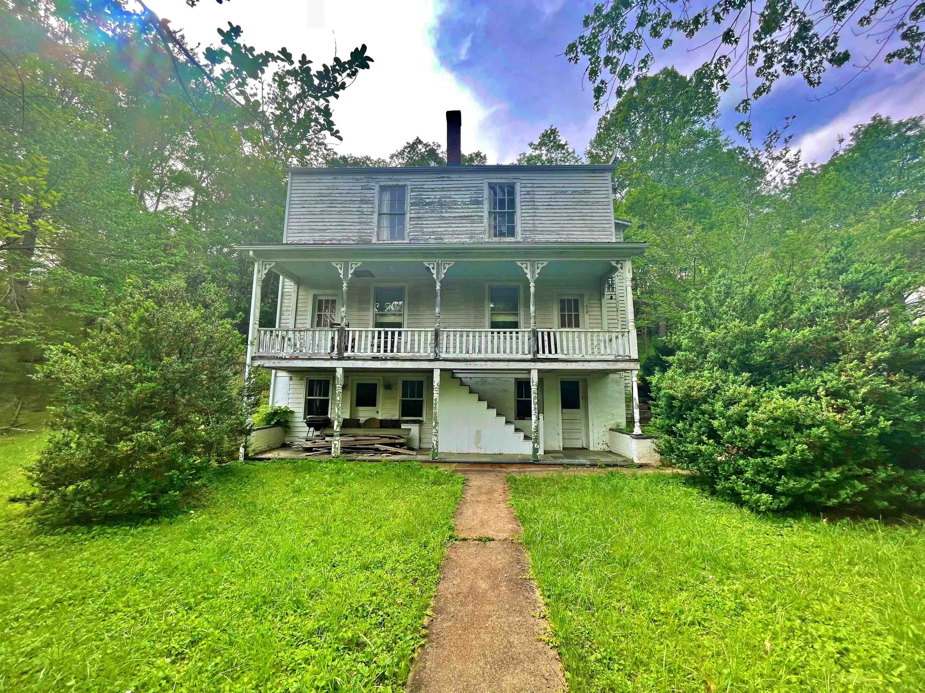 9264 Schuyler Road Schuyler, VA 22969 - Photo 2 of 20 a front view of a house with a yard table and chairs
